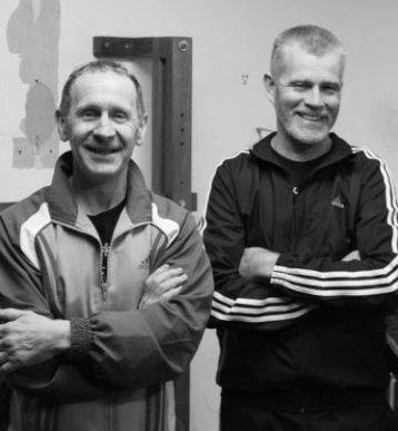 Ged Kennerk (Stockport Wing Chun Academy) standing next to his teacher David Peterson (Malaysian Combat Science WSL VT) in the picture